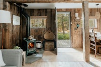 a living room with a wood burning stove